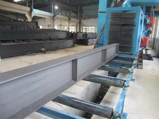 石柱自动输送重型工件喷砂机及其应用